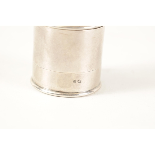 338 - A GEORGE V 'CLARK'S PYRAMID' SILVER CANDLE HOLDER of plain cylindrical form with detachable base and... 