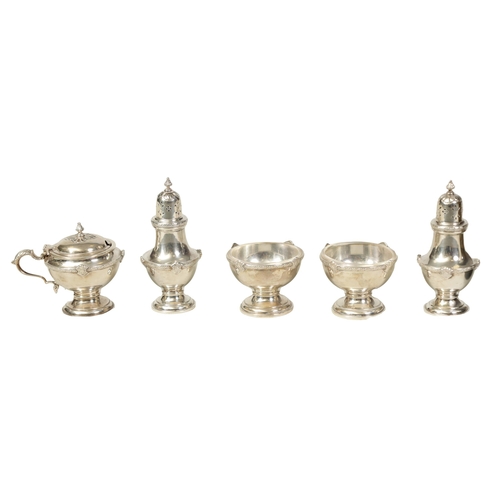 340 - A 1930’S SILVER FIVE PIECE CRUET SET Comprising of two casters, glass lined mustard pot and two cond... 