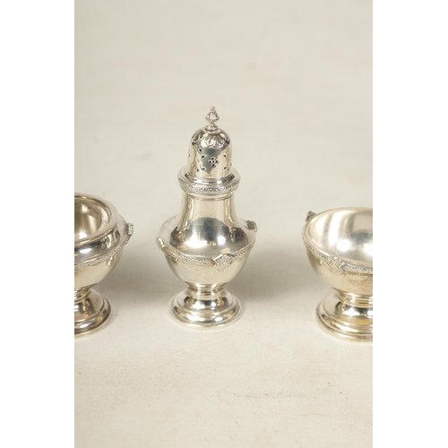 340 - A 1930’S SILVER FIVE PIECE CRUET SET Comprising of two casters, glass lined mustard pot and two cond... 