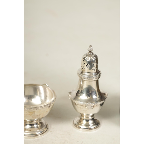 340 - A 1930’S SILVER FIVE PIECE CRUET SET Comprising of two casters, glass lined mustard pot and two cond... 