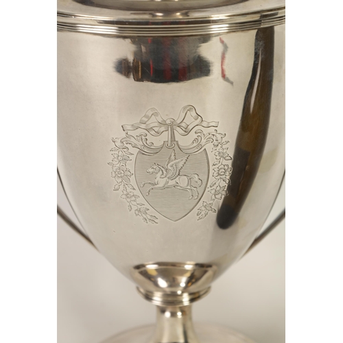 342 - A FINE GEORGE III SILVER TROPHY CUP AND COVER OF LARGE SIZE the urn-shaped body on a ribbed pedestal... 