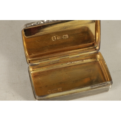 344 - A WILLIAM IV SILVER AND SILVER GILT SNUFF BOX of rectangular form with reeded decoration, the lid wi... 