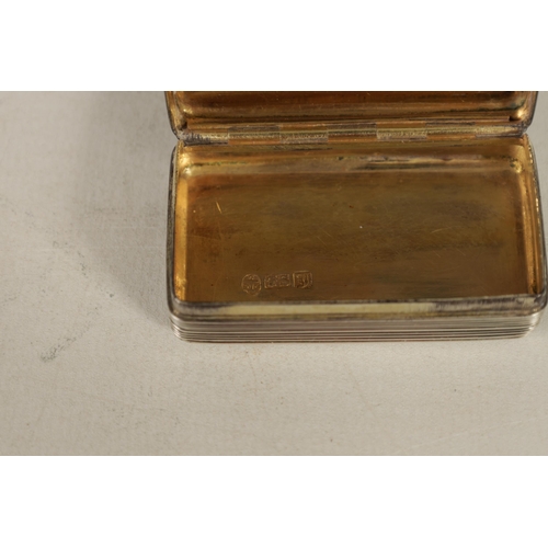 344 - A WILLIAM IV SILVER AND SILVER GILT SNUFF BOX of rectangular form with reeded decoration, the lid wi... 