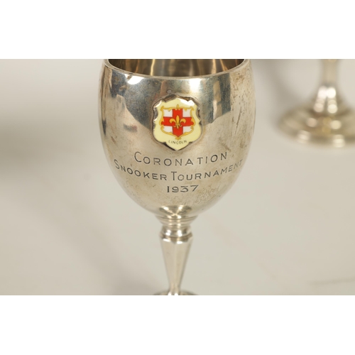 356 - A GEORGE V SILVER PRESENTATION TROPHY CUP & A SIMILAR SMALL SILVER CUP the larger of two handled ped... 