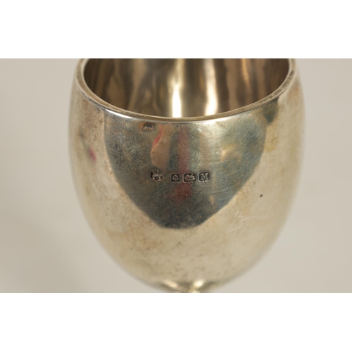 356 - A GEORGE V SILVER PRESENTATION TROPHY CUP & A SIMILAR SMALL SILVER CUP the larger of two handled ped... 