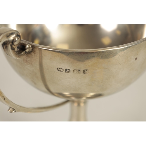 356 - A GEORGE V SILVER PRESENTATION TROPHY CUP & A SIMILAR SMALL SILVER CUP the larger of two handled ped... 