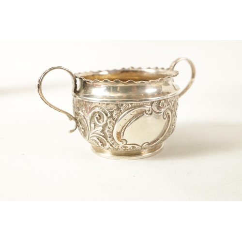 359 - A COLLECTION OF FOUR SILVER ITEMS including A scroll and leafwork embossed TWO-HANDLED SILVER BOWL, ... 