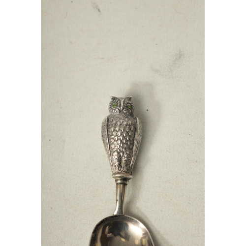 361 - A GEORGIAN SILVER CADDY SPOON with finely engraved owl handle set with green gemstone eyes, Birmingh... 