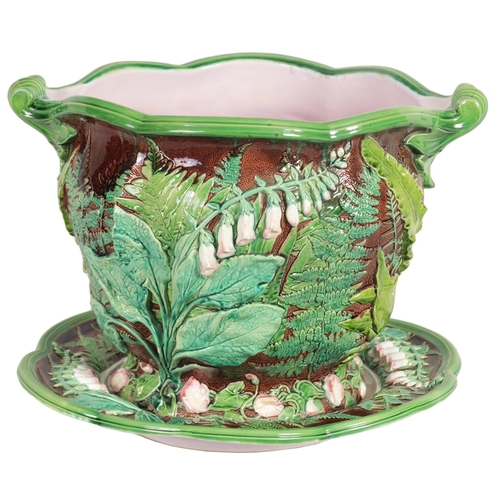 37 - A 19TH CENTURY OVERSIZED MINTON MAJOLICA JARDINIERE ON STAND the high relief moulded body with scall... 