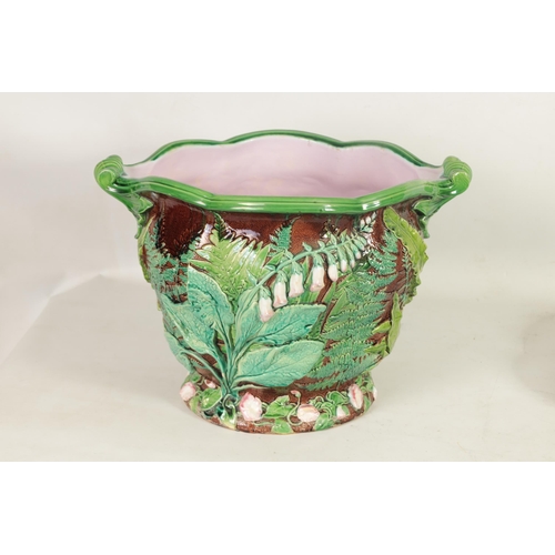 37 - A 19TH CENTURY OVERSIZED MINTON MAJOLICA JARDINIERE ON STAND the high relief moulded body with scall... 