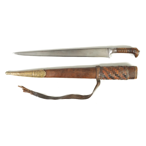 372 - A 19TH CENTURY INDIAN KHYBER KNIFE with a broad tapering single edged steel blade, flattened spine a... 