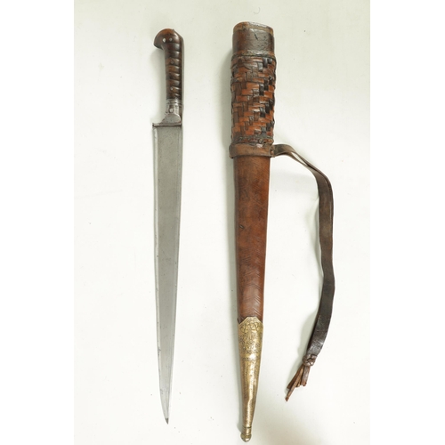 372 - A 19TH CENTURY INDIAN KHYBER KNIFE with a broad tapering single edged steel blade, flattened spine a... 