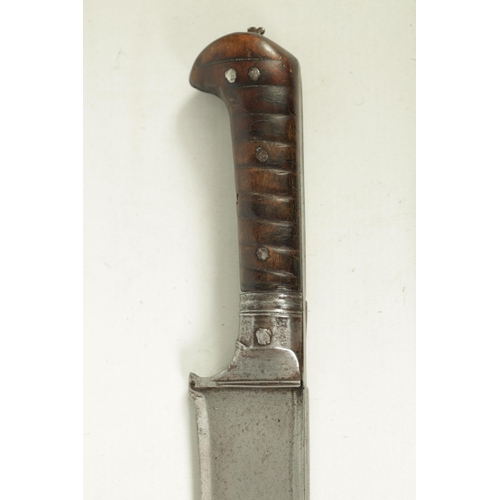 372 - A 19TH CENTURY INDIAN KHYBER KNIFE with a broad tapering single edged steel blade, flattened spine a... 