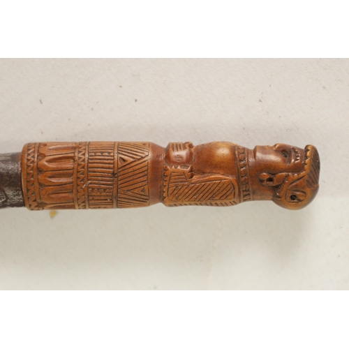 374 - A RARE 17TH CENTURY CARVED FIGURAL FRUITWOOD POCKET KNIFE modelled as a lady with a carved patterned... 