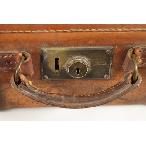 379 - A 19TH CENTURY LEATHER BOUND CARTRIDGE CASE with brass corners and leather straps revealing a lined ... 