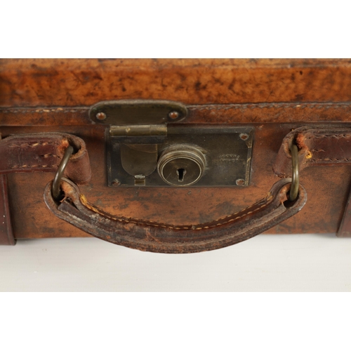 379 - A 19TH CENTURY LEATHER BOUND CARTRIDGE CASE with brass corners and leather straps revealing a lined ... 