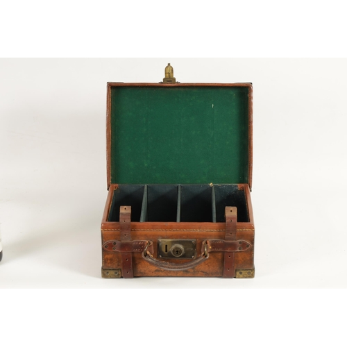 379 - A 19TH CENTURY LEATHER BOUND CARTRIDGE CASE with brass corners and leather straps revealing a lined ... 