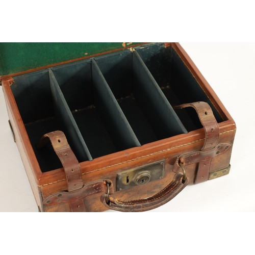 379 - A 19TH CENTURY LEATHER BOUND CARTRIDGE CASE with brass corners and leather straps revealing a lined ... 