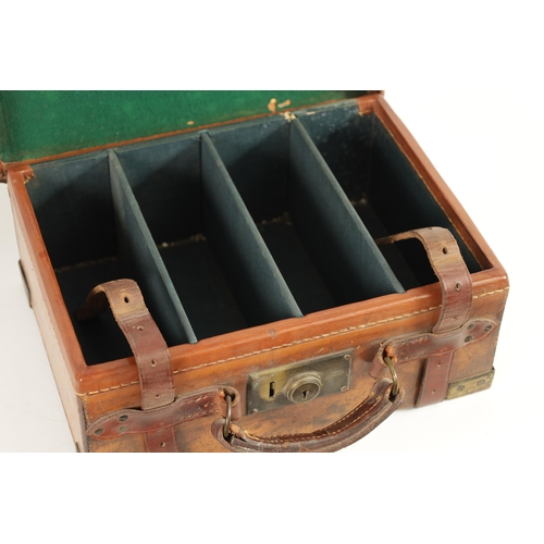 379 - A 19TH CENTURY LEATHER BOUND CARTRIDGE CASE with brass corners and leather straps revealing a lined ... 