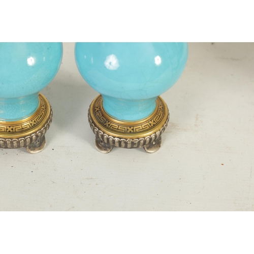 38 - A PAIR OF 19TH CENTURY MINTON AESTHETIC MOVEMENT GILT AND TURQUOISE VASES the bulbous bodies with pi... 