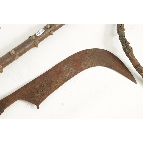 384 - A 19TH CENTURY AFRICAN SCYTHE AND WHIP the whip with wire bound handle and brass mounted studs, the ... 