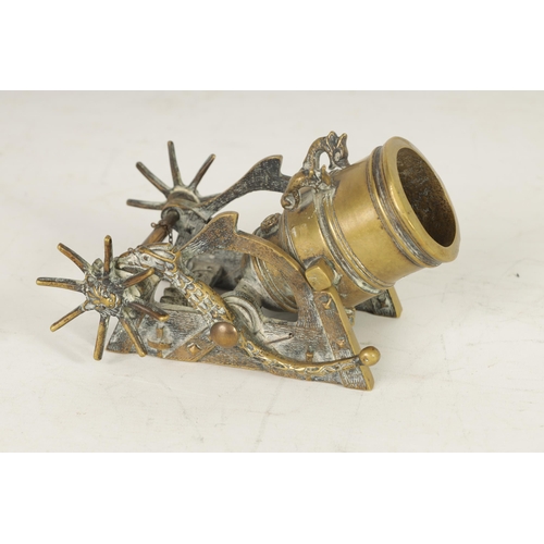 388 - A 19TH CENTURY CAST BRASS STARTER CANNON with simulated wooden carriage having bird shaped ratchet a... 