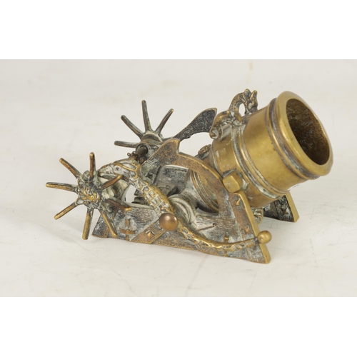 388 - A 19TH CENTURY CAST BRASS STARTER CANNON with simulated wooden carriage having bird shaped ratchet a... 