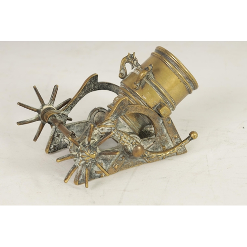 388 - A 19TH CENTURY CAST BRASS STARTER CANNON with simulated wooden carriage having bird shaped ratchet a... 