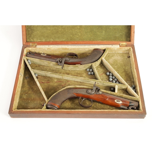 391 - A CASED PAIR OF EARLY 19TH CENTURY PERCUSSION PISTOLS BY MOORE, LONDON. with octagonal sighted barre... 