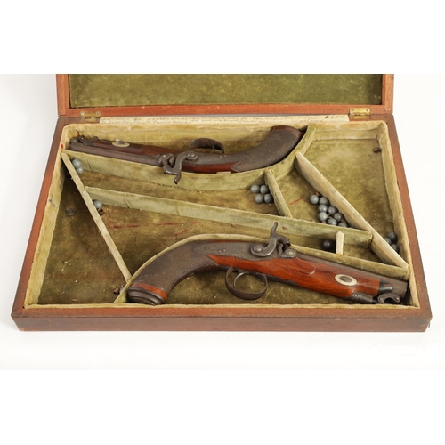 391 - A CASED PAIR OF EARLY 19TH CENTURY PERCUSSION PISTOLS BY MOORE, LONDON. with octagonal sighted barre... 