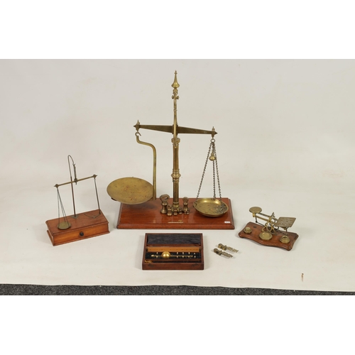 410 - A COLLECTION OF 19TH CENTURY WEIGHING SCALES the largest set of shop scales and bell weights labelle... 