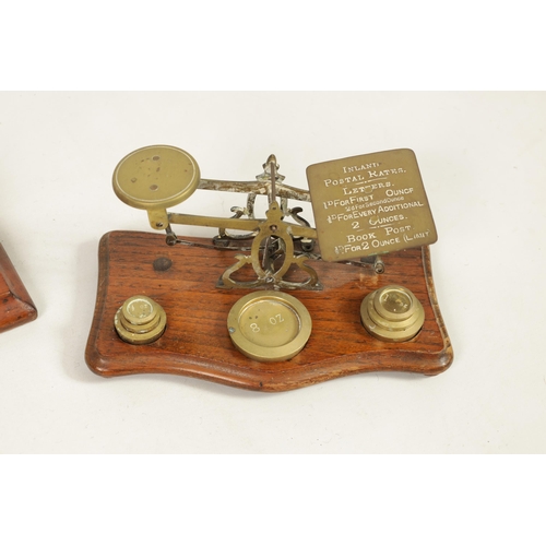 410 - A COLLECTION OF 19TH CENTURY WEIGHING SCALES the largest set of shop scales and bell weights labelle... 