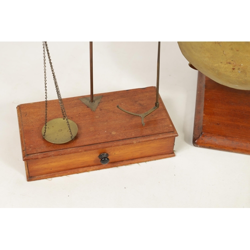 410 - A COLLECTION OF 19TH CENTURY WEIGHING SCALES the largest set of shop scales and bell weights labelle... 