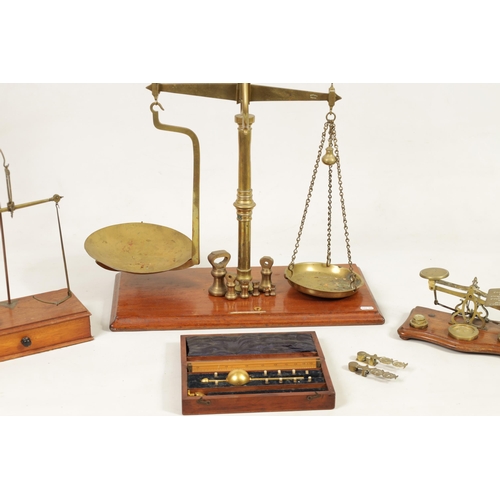 410 - A COLLECTION OF 19TH CENTURY WEIGHING SCALES the largest set of shop scales and bell weights labelle... 