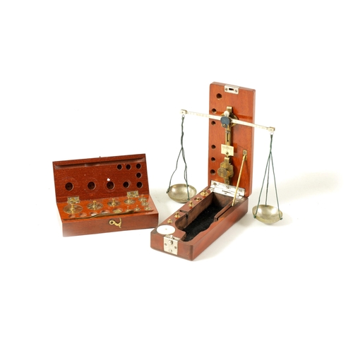 411 - A CASED SET OF FOLDING JEWELLERY SCALES TOGETHER WITH A SET OF OERTLING WEIGHTS (2) (Scales case mea... 