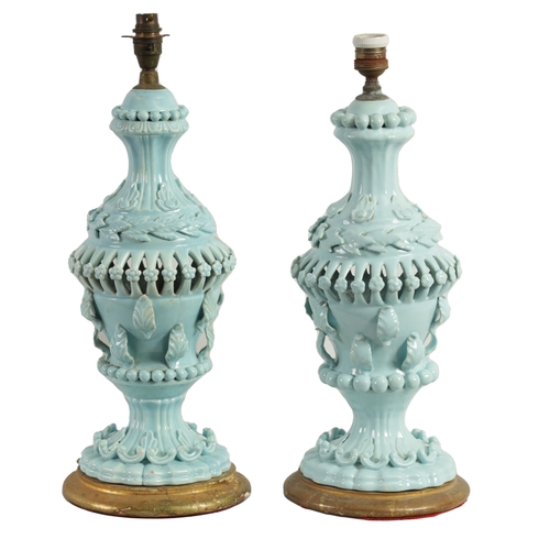 42 - A PAIR OF LATE 19TH CENTURY CASA PUPO CERAMIC TABLE LAMPS of bulbous pierced form with applied leafw... 