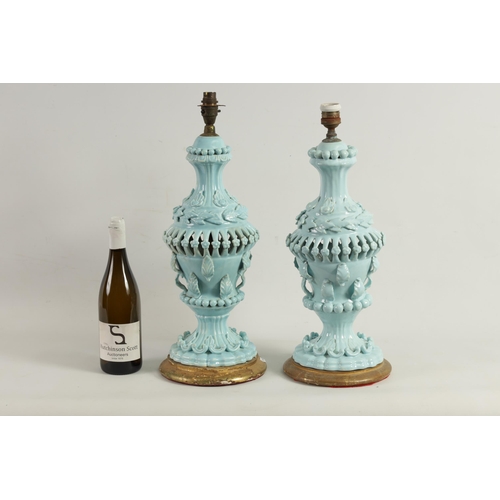 42 - A PAIR OF LATE 19TH CENTURY CASA PUPO CERAMIC TABLE LAMPS of bulbous pierced form with applied leafw... 