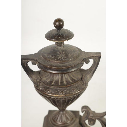 424 - A 19TH CENTURY FRENCH BRONZE ADJUSTABLE HEARTH FENDER with raised urn finials on an engraved shaped ... 