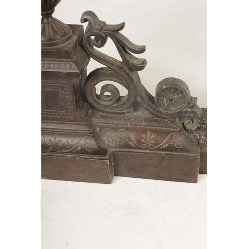 424 - A 19TH CENTURY FRENCH BRONZE ADJUSTABLE HEARTH FENDER with raised urn finials on an engraved shaped ... 