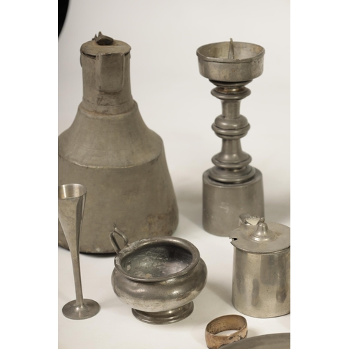 427 - A COLLECTION OF 18TH/19TH CENTURY PEWTER ITEMS including ale jugs, plate warmers, tankards and prick... 