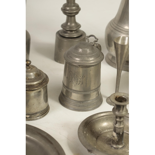 427 - A COLLECTION OF 18TH/19TH CENTURY PEWTER ITEMS including ale jugs, plate warmers, tankards and prick... 