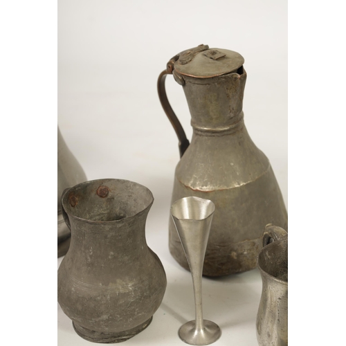 427 - A COLLECTION OF 18TH/19TH CENTURY PEWTER ITEMS including ale jugs, plate warmers, tankards and prick... 