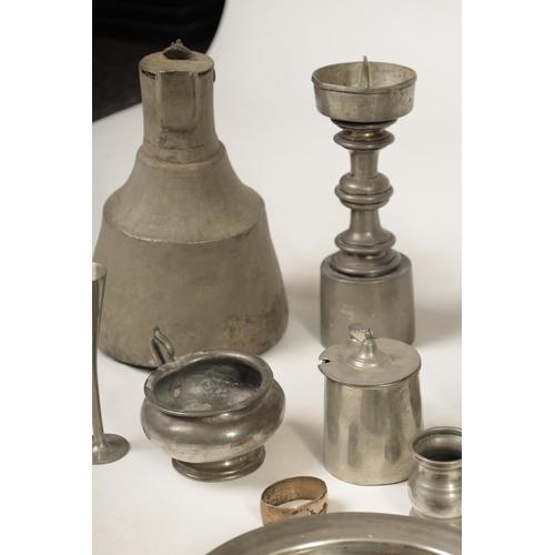 427 - A COLLECTION OF 18TH/19TH CENTURY PEWTER ITEMS including ale jugs, plate warmers, tankards and prick... 