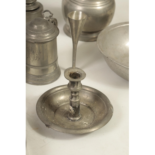 427 - A COLLECTION OF 18TH/19TH CENTURY PEWTER ITEMS including ale jugs, plate warmers, tankards and prick... 