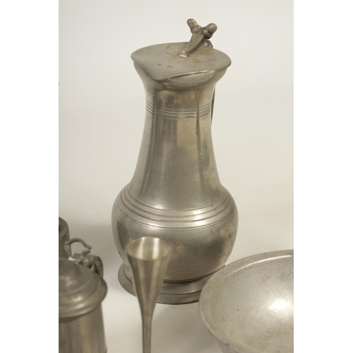 427 - A COLLECTION OF 18TH/19TH CENTURY PEWTER ITEMS including ale jugs, plate warmers, tankards and prick... 