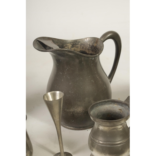 427 - A COLLECTION OF 18TH/19TH CENTURY PEWTER ITEMS including ale jugs, plate warmers, tankards and prick... 