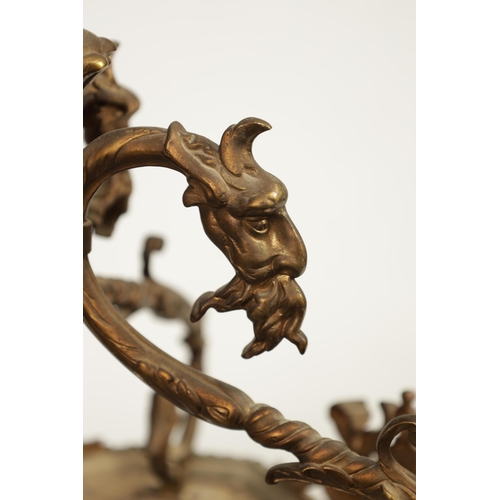 430 - A LATE 19TH CENTURY CAST BRASS HANGING LANTERN the arched glazed sides with mask head and caryatid c... 