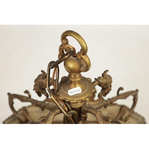 430 - A LATE 19TH CENTURY CAST BRASS HANGING LANTERN the arched glazed sides with mask head and caryatid c... 