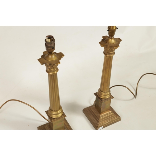 432 - A PAIR OF 20TH CENTURY GILT BRASS CORINTHIAN COLUMN TABLE LAMPS with square bases. (48cm high overal... 