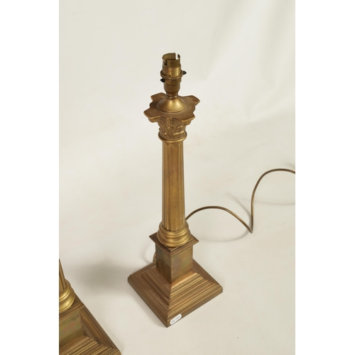 432 - A PAIR OF 20TH CENTURY GILT BRASS CORINTHIAN COLUMN TABLE LAMPS with square bases. (48cm high overal... 